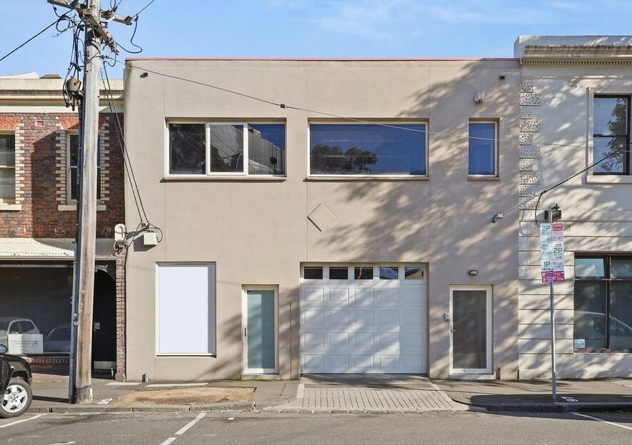 Front facade of commercial property for lease in North Melbourne. Premium commercial office space. Available now.
