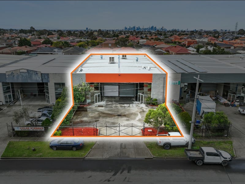 Aerial view of 20 Webber Parade, Keilor East with site boundary outlined and Melbourne CBD skyline in distance