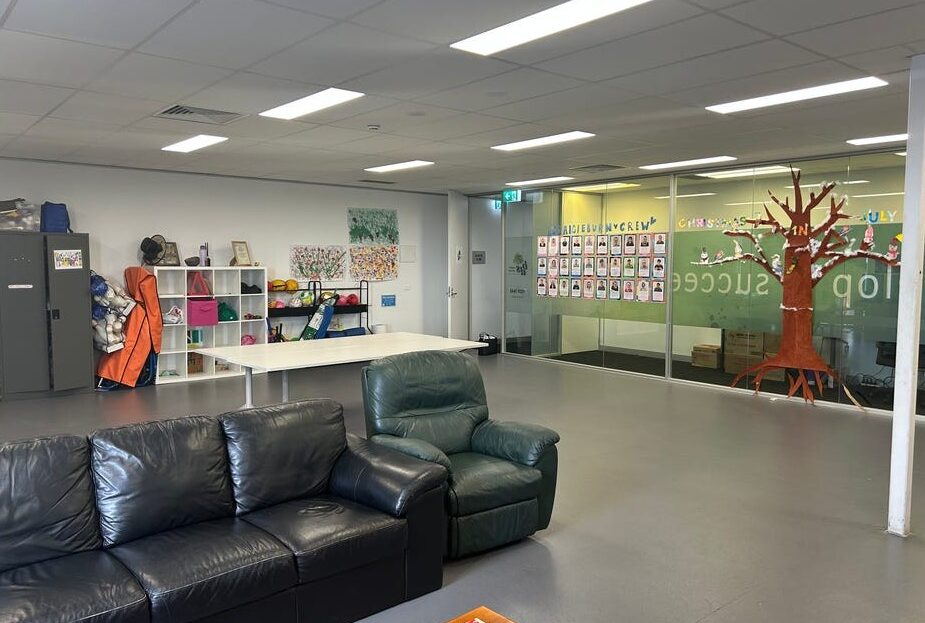 Interior of healthcare property with open-plan seating and educational wall display at Craigieburn Junction