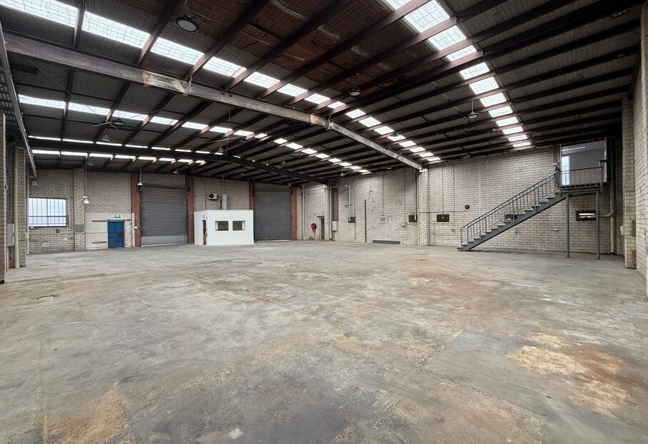 Spacious high clearance warehouse with roller door access at 2 Disney Avenue Keilor East