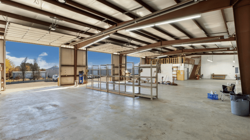 Spacious industrial warehouse interior with open doors available for lease in Hoppers Crossing, Melbourne, bright, modern, and ideal for logistics, manufacturing, or storage.